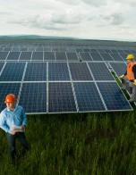 technicians inspecting solar panel station