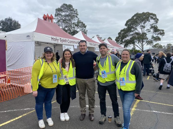 Michael Sukkar MP posing with four volunteers from Holy Spirit Community at their Fete