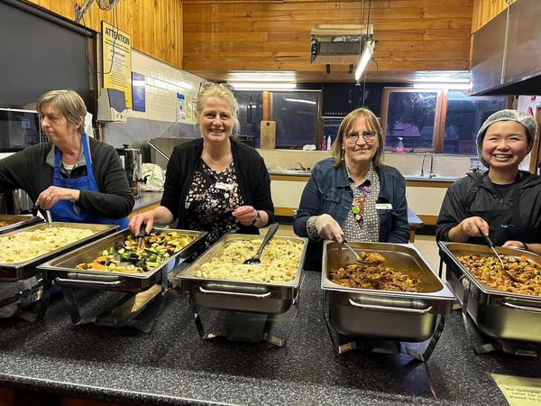 Volunteers from Winter Shelter serving meals