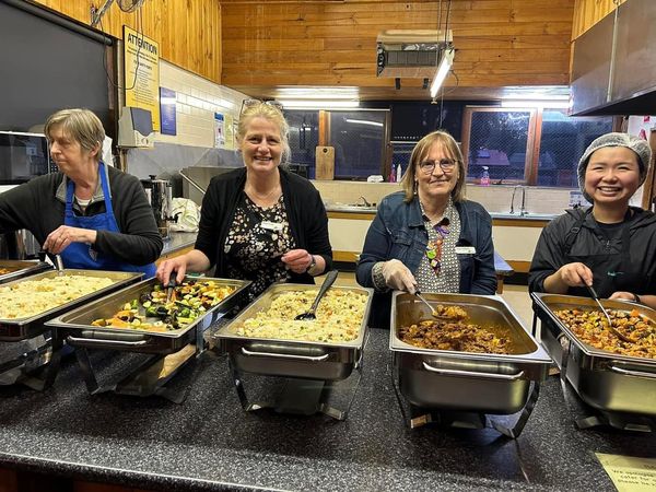 Volunteers from Winter Shelter serving meals